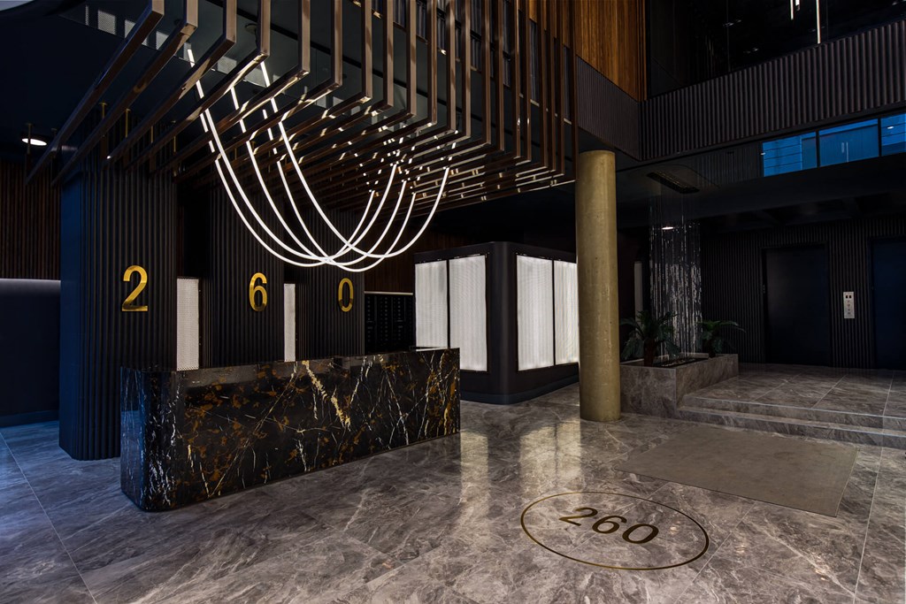 the lobby of a building with a sculpture of aorah on the ceiling